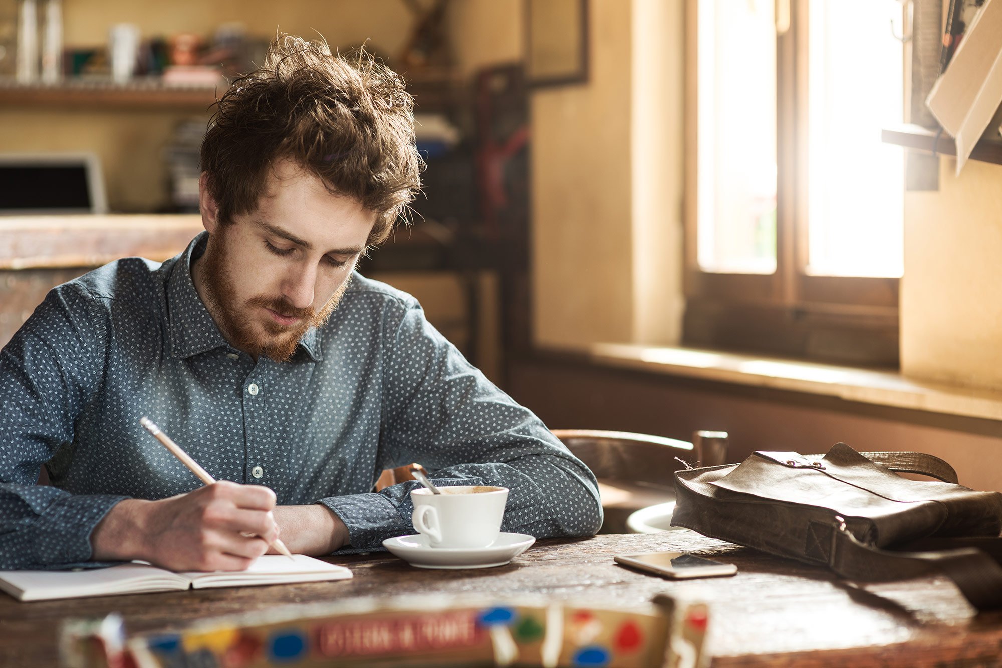 A person writing at a desk